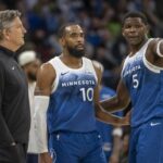 Minnesota Timberwolves head coach Chris Finch, guard Mike Conley (10), guard Anthony Edwards (5) huddle against the Cleveland Cavaliers in the second half at Target Center.