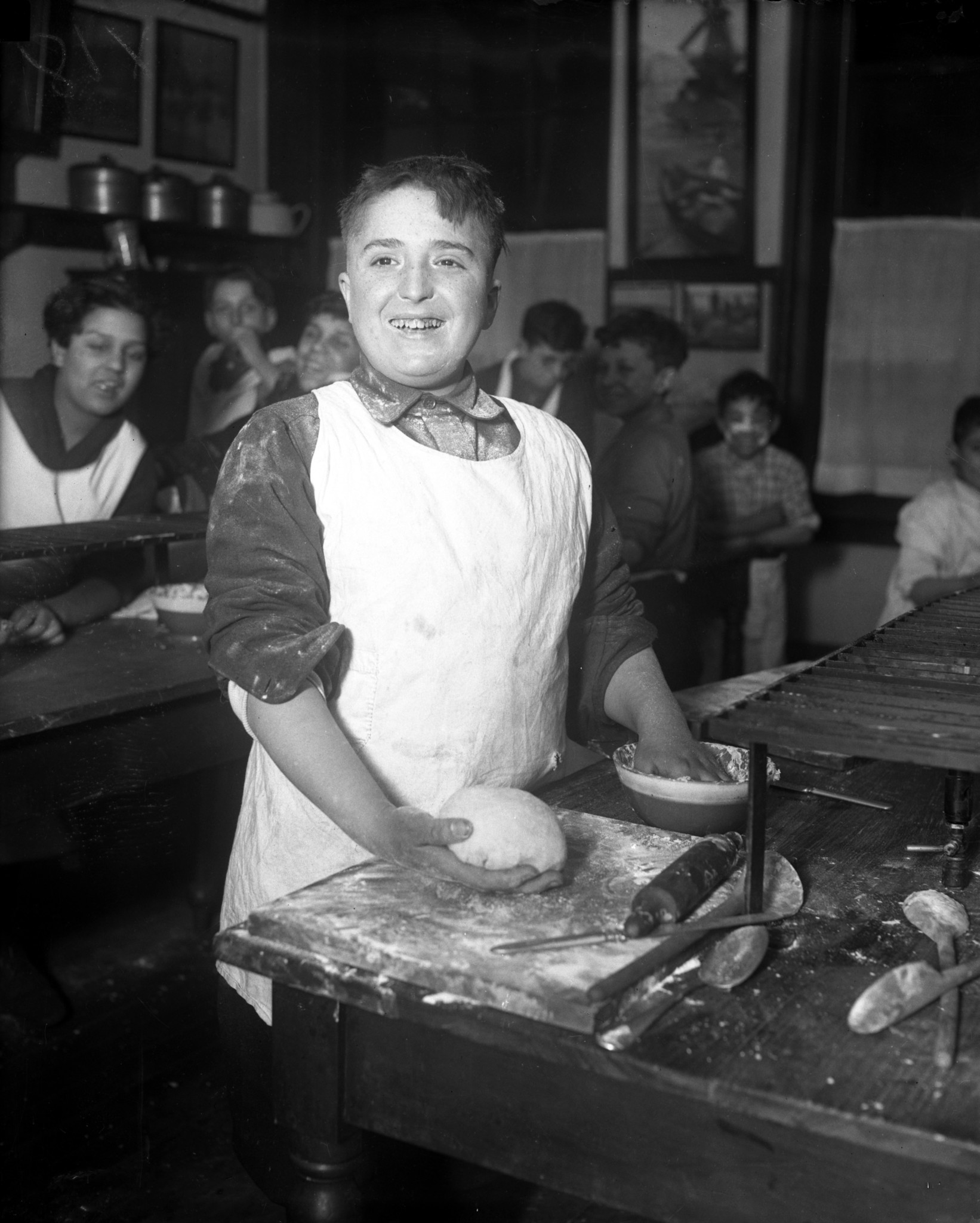 Dominick Sposato works in a boys cooking class at Hull...