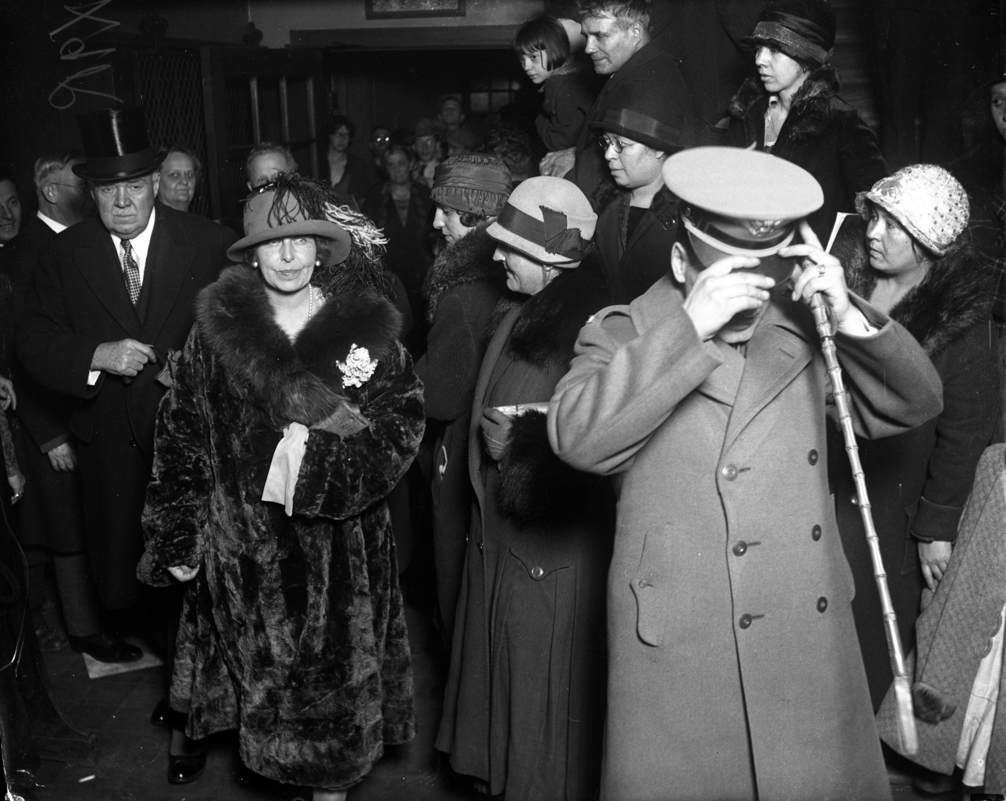 Queen Marie of Romania walks through Hull House during her...