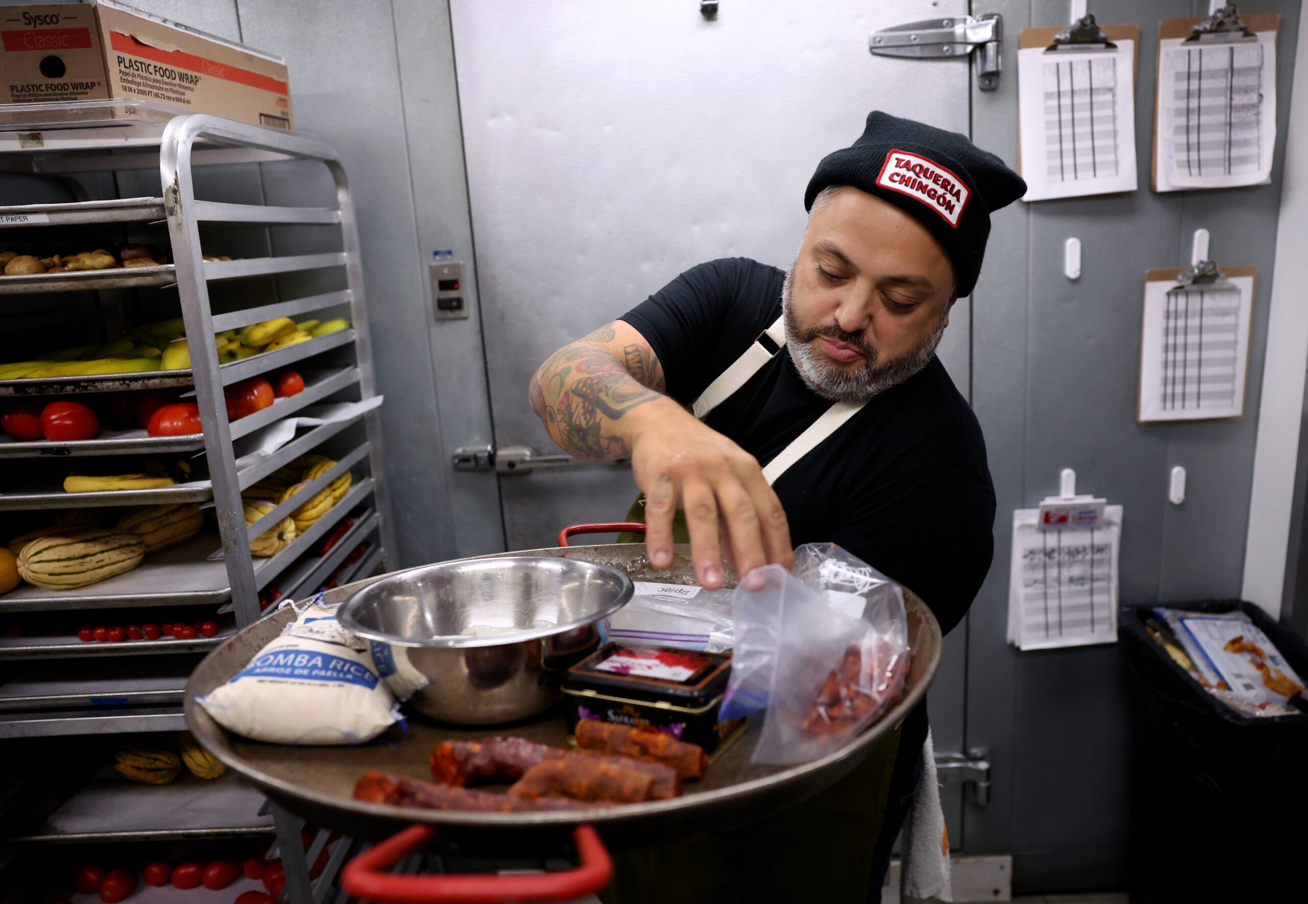 Chef Marcos Asencio organizes items to be used in a...