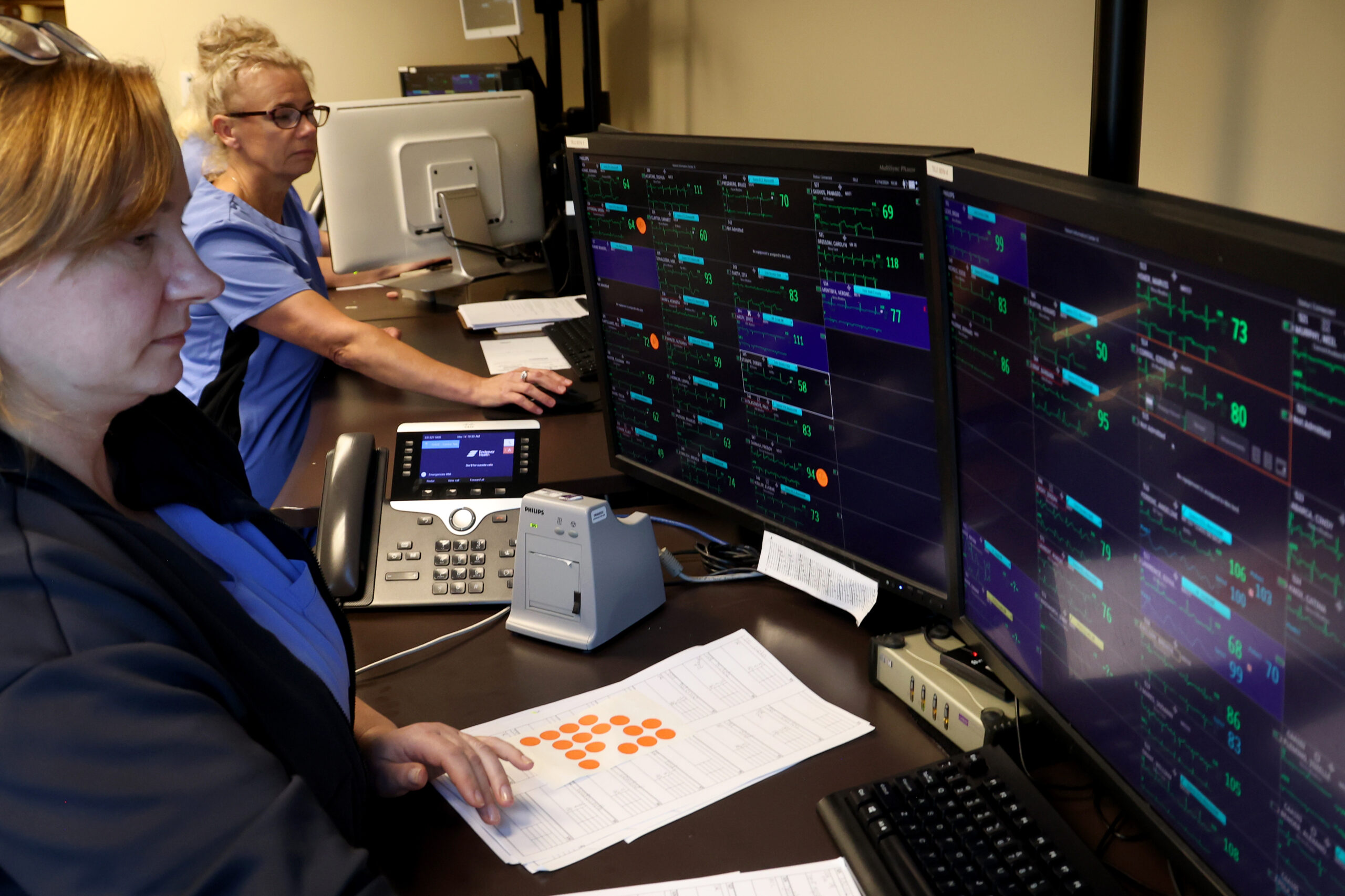 Staff members Renata Wrona and Bonnie Sasara monitor patients' heartbeats...