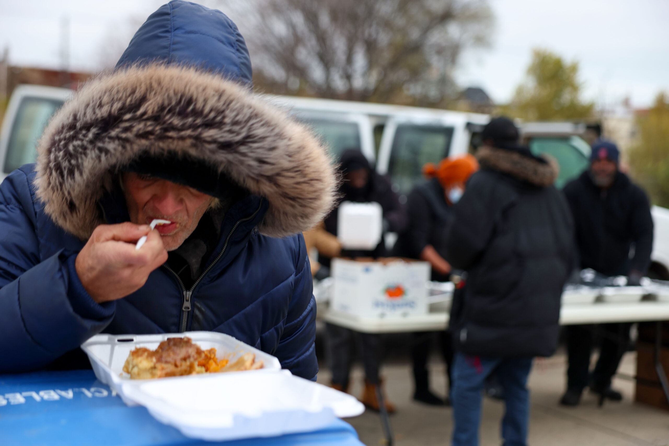 Tom Dukes sets his container of food on top of...