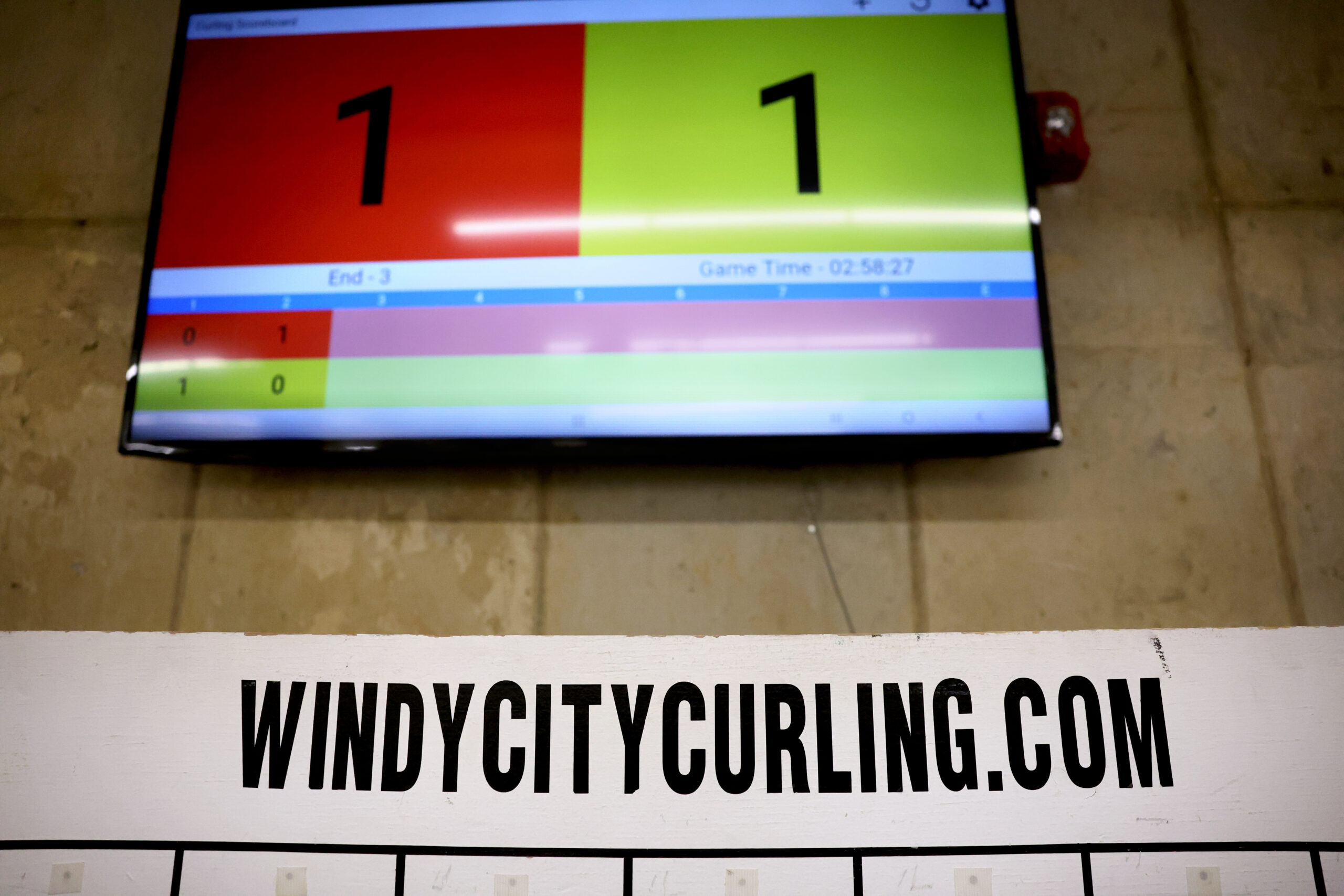 A scoreboard records a club league competition at Windy City...