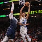 Atlanta Hawks forward Zaccharie Risacher (10) is defended by Dallas Mavericks center Daniel Gafford (21)