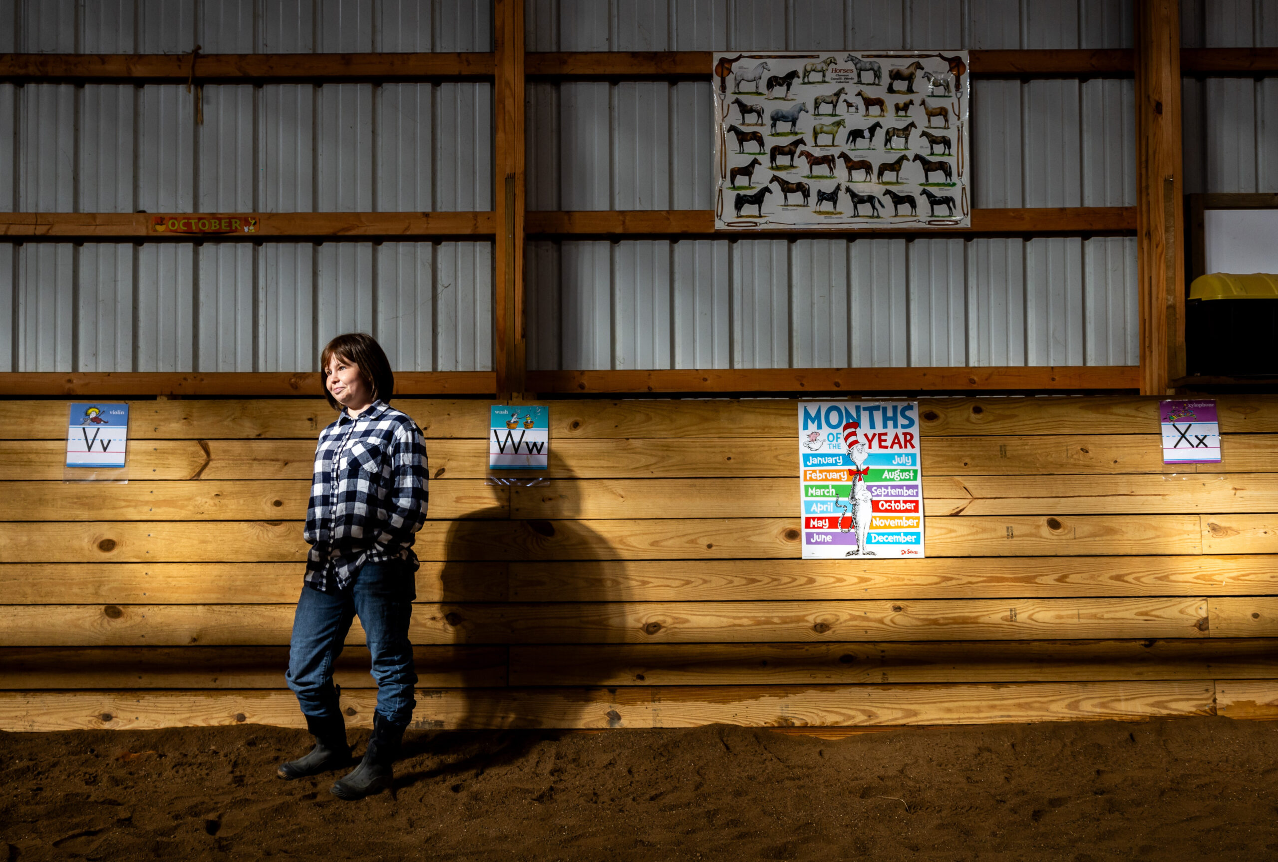 Sarah Sauer, 31, left, waits for Liam Bullington, 12, off...