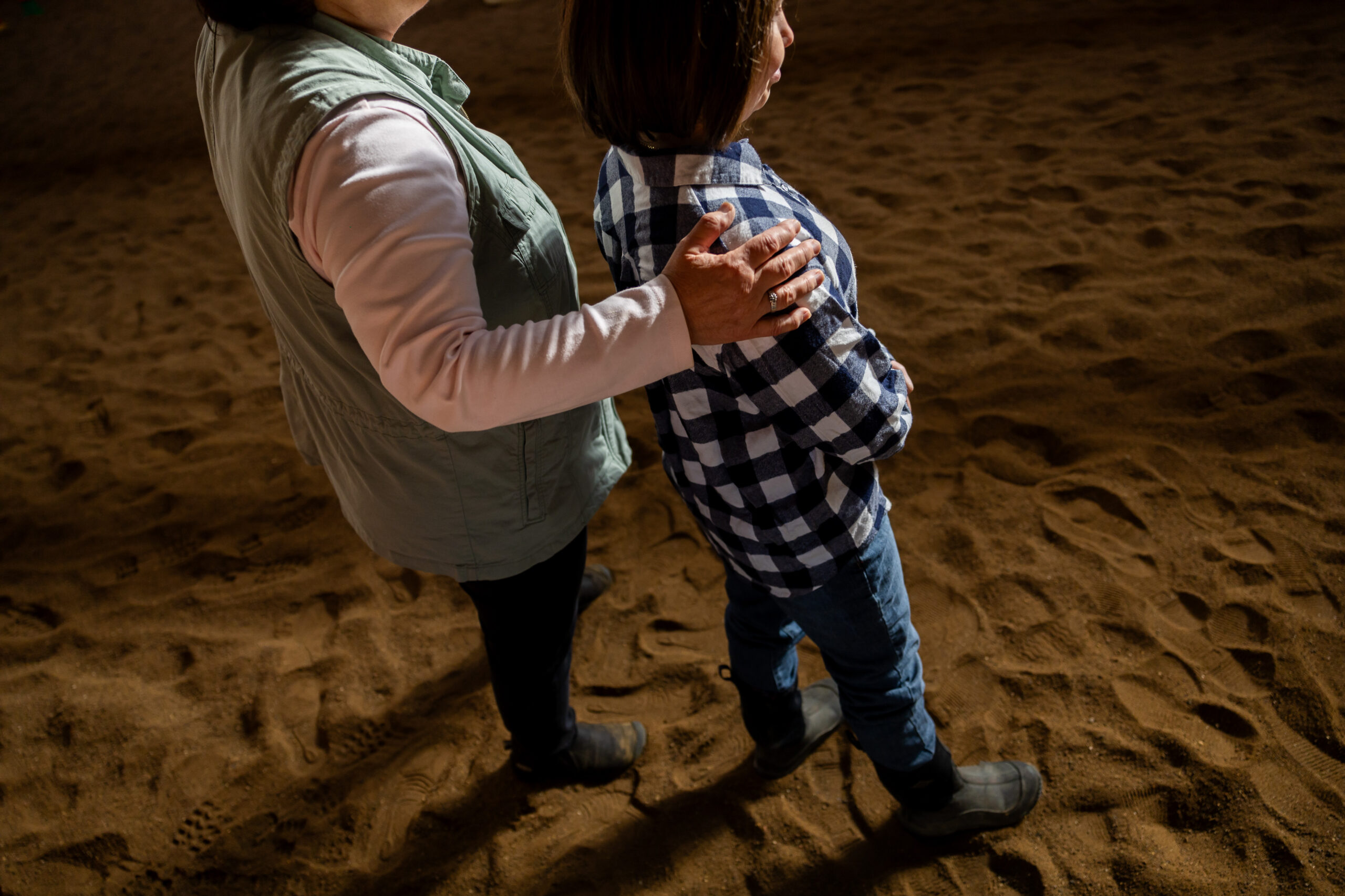 Cindy Sauer, left, and her daughter Sarah, 31, right, wait...