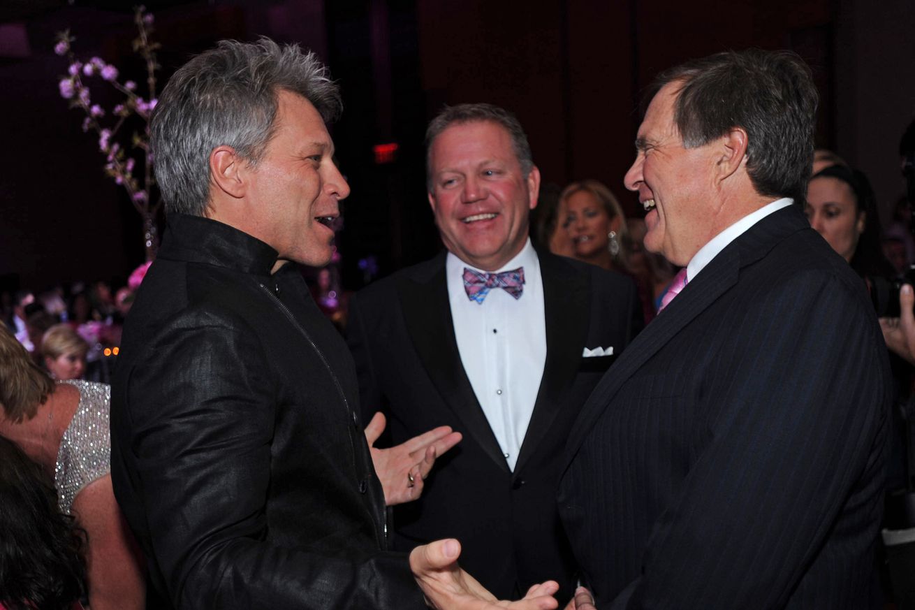 (Boston, MA, 05/20/14) Jon Bon Jovi, left, Notre Dame football coach Brian Kelly and New England Patriots head coach Bill Belichick talk during the Breast Cancer Research Foundation Hot Pink Party at the Intercontinental Hotel on Tuesday, May 20, 201