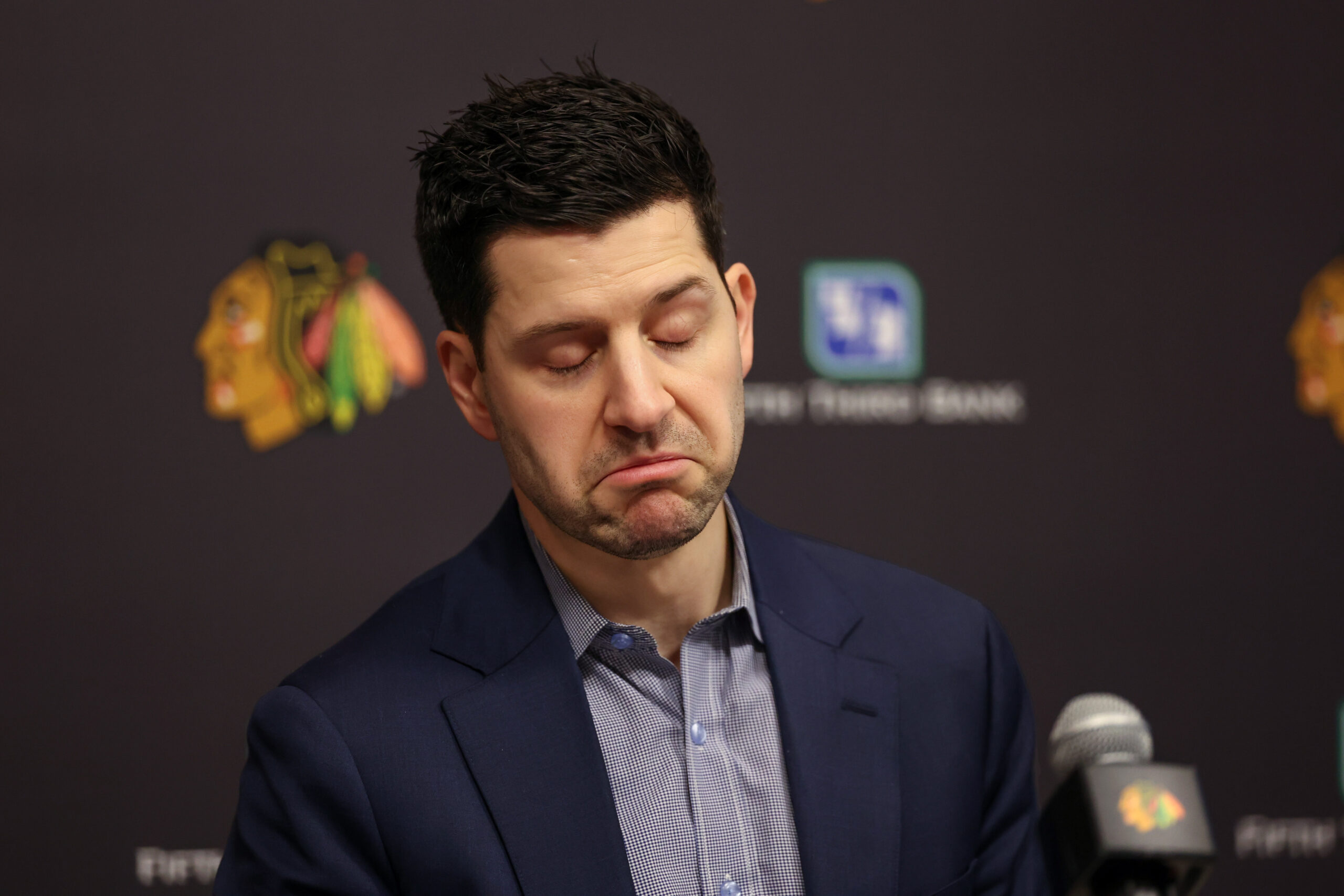 Blackhawks general manager Kyle Davidson speaks with the media following...