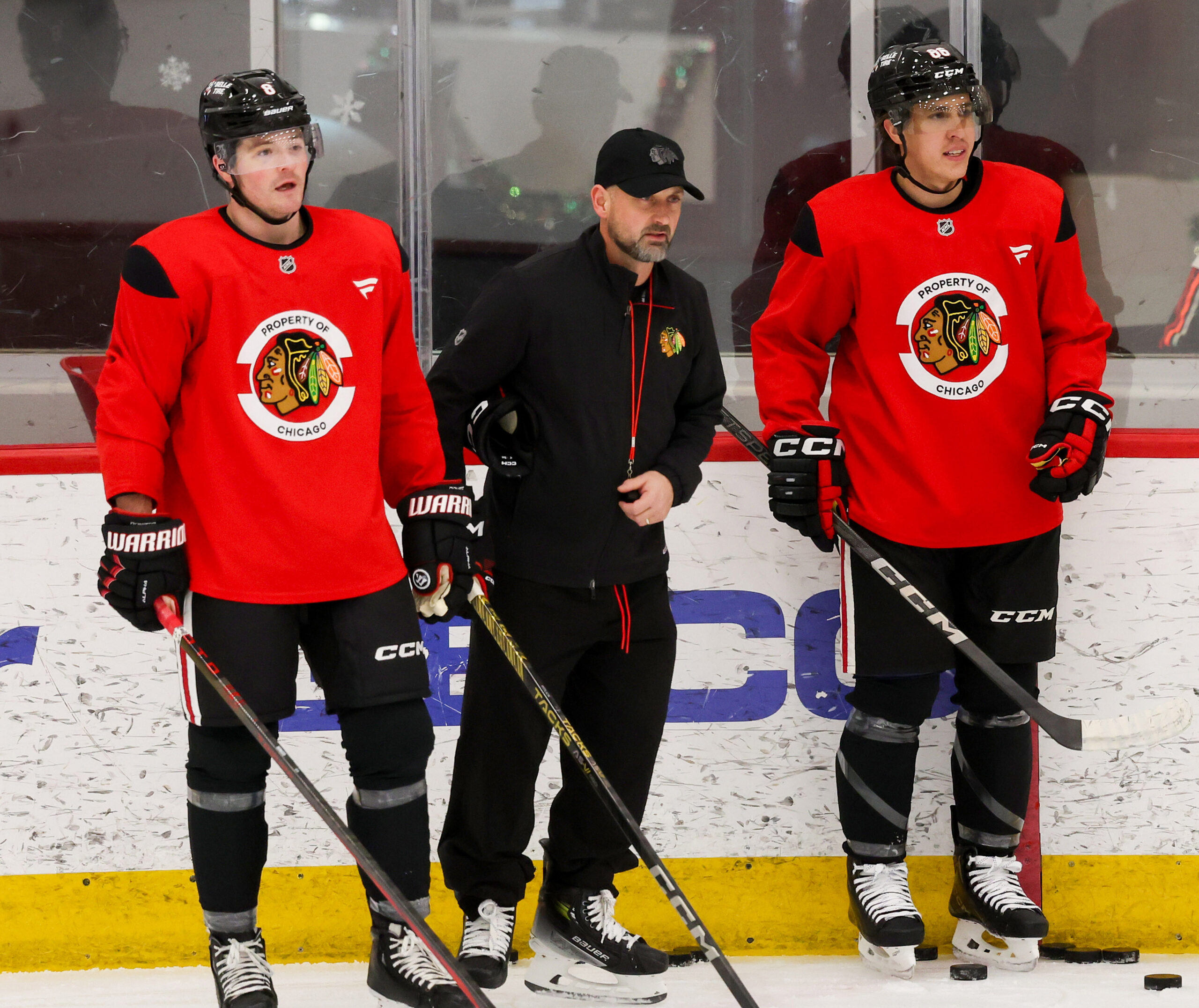 Blackhawks interim head coach Anders Sorensen and centers Ryan Donato...