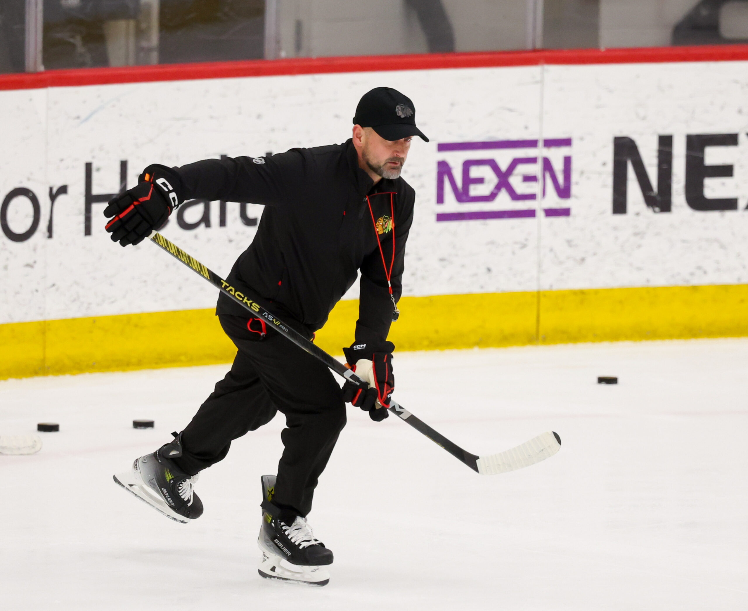 Blackhawks interim head coach Anders Sorensen skates during his first...