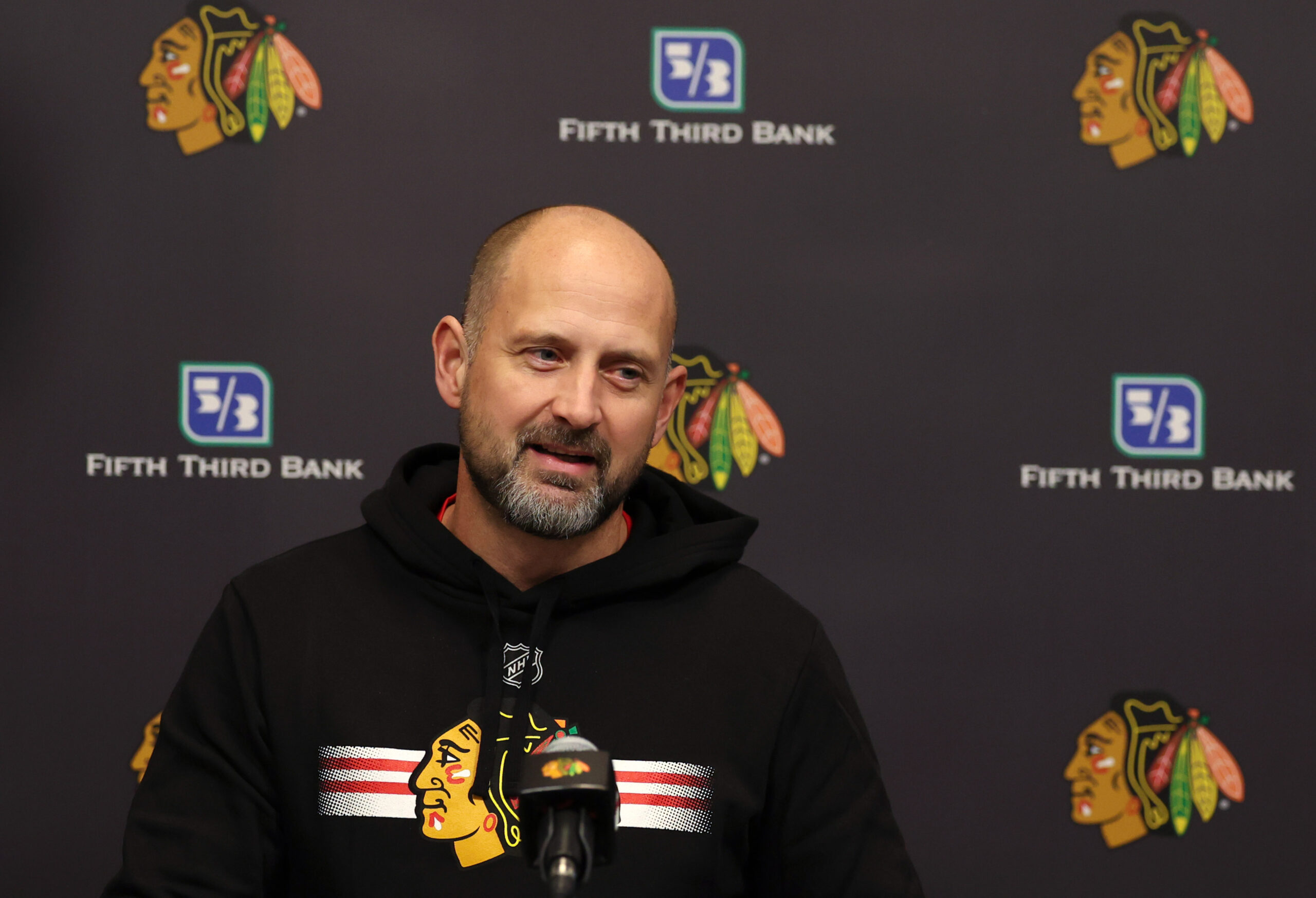 Blackhawks interim head coach Anders Sorensen speaks with the media...