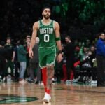 Dec 25, 2024; Boston, Massachusetts, USA; Boston Celtics forward Jayson Tatum (0) walks on the court during a timeout during the second half against the Philadelphia 76ers at TD Garden. Mandatory Credit: Eric Canha-Imagn Images