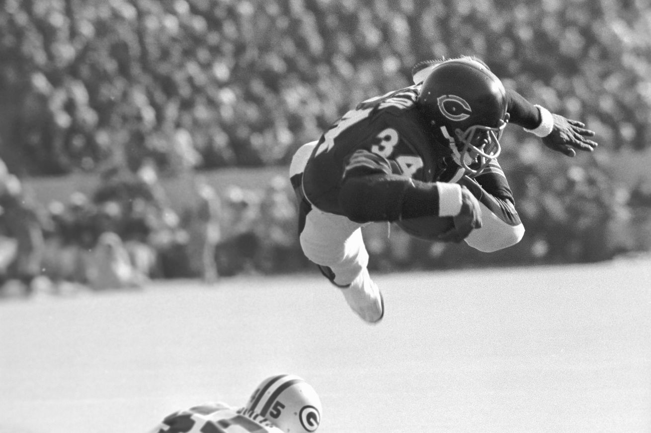 Walter Payton in Mid-Leap With Football