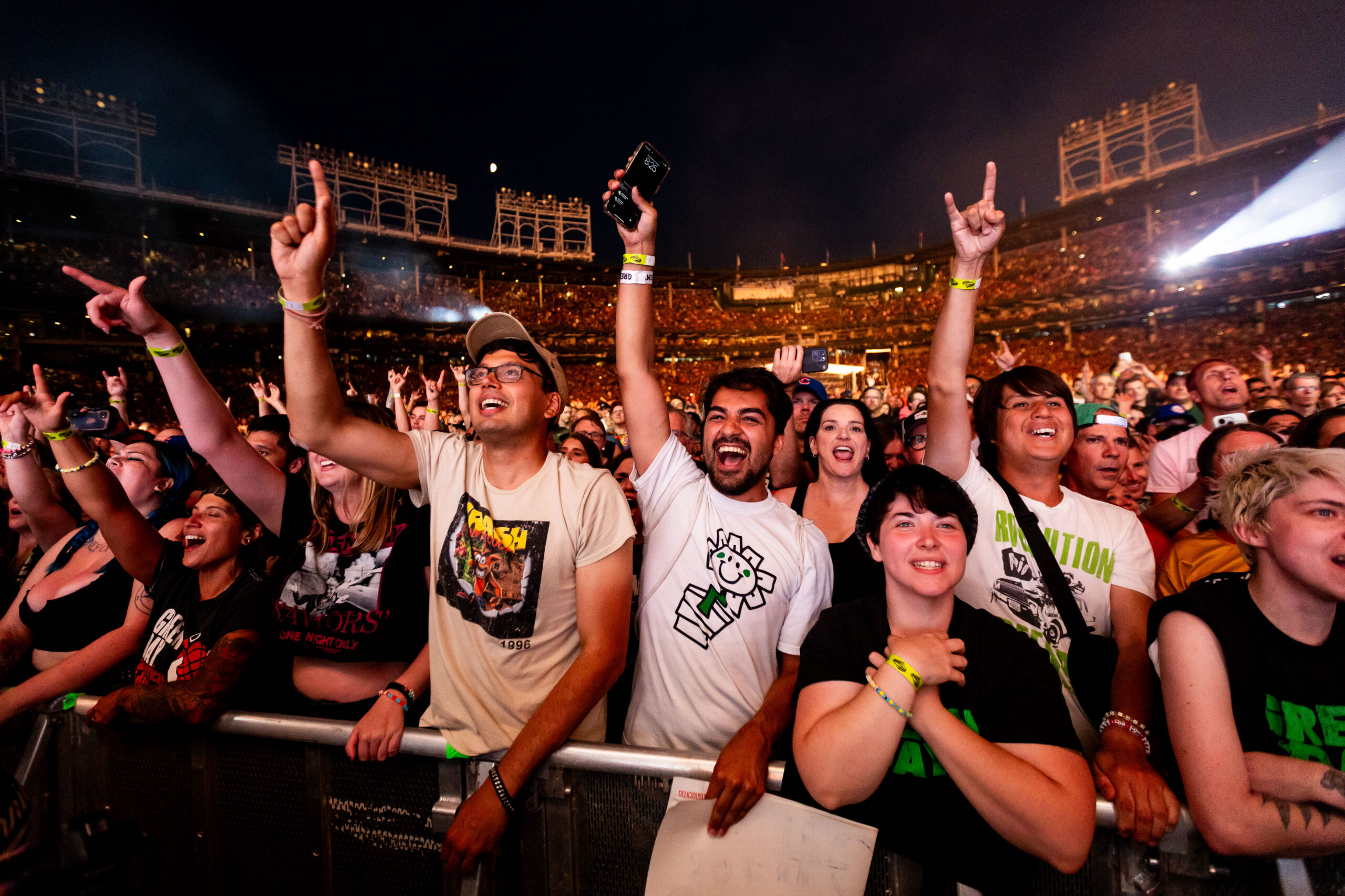 Fans watch as Green Day performs at Wrigley Field in...