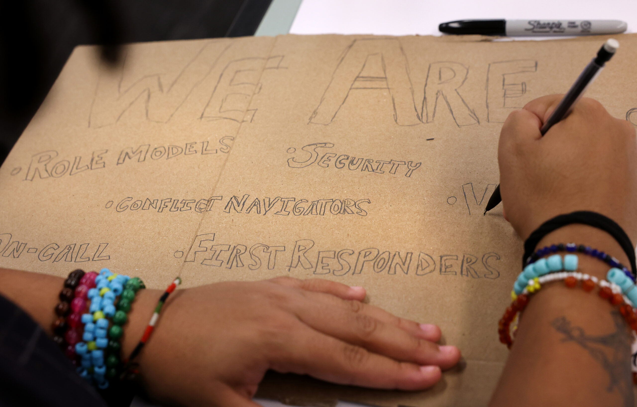 Elisa Hoffman creates a sign Jan. 29, 2025. (Chris Sweda/Chicago...