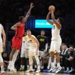 Utah Jazz forward Brice Sensabaugh (28) shoots over Miami Heat guard Josh Christopher (8)