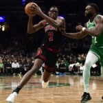 Jan 29, 2025; Boston, Massachusetts, USA; Chicago Bulls forward Jalen Smith (7) controls the ball while Boston Celtics guard Jaylen Brown (7) defends during the second half at TD Garden.