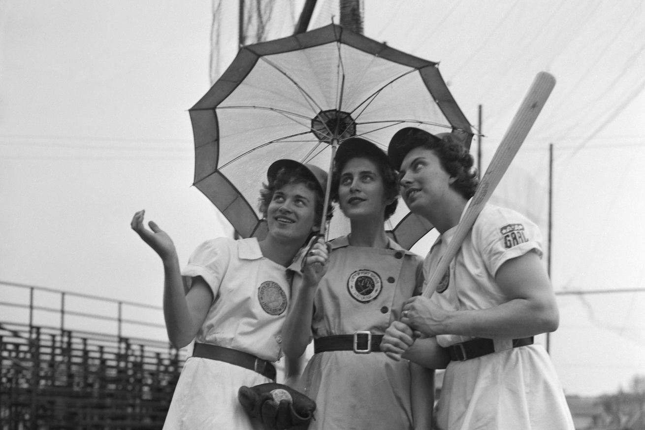 Women in Baseball Uniforms with Umbrella