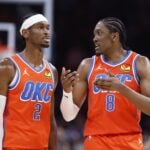 Nov 10, 2024; Oklahoma City, Oklahoma, USA; Oklahoma City Thunder guard Shai Gilgeous-Alexander (2) and forward Jalen Williams (8) talk during a time out against the Golden State Warriors during the second half at Paycom Center. Mandatory Credit: Alonzo Adams-Imagn Images