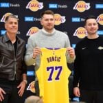 Feb 4, 2025; El Segundo, CA, USA; Los Angeles Lakers guard Luka Doncic poses for photos with general manager Rob Pelinka and head coach JJ Redick at UCLA Health Training Center. Mandatory Credit: Gary A. Vasquez-Imagn Images