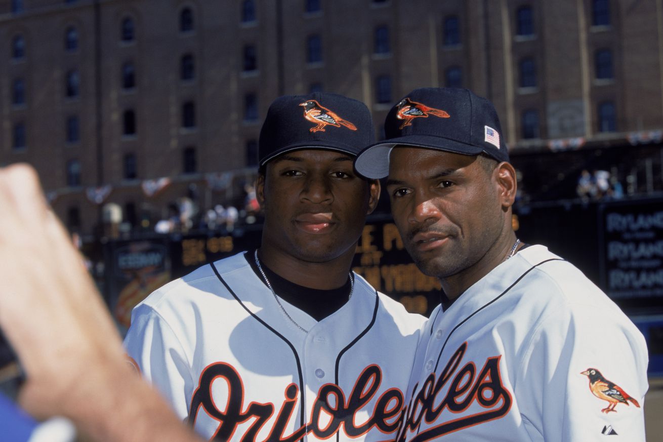 Baltimore Orioles left fielder Tim Raines Sr. #30 signs a baseball