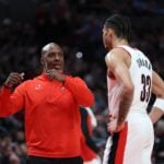 Mar 9, 2025; Portland, Oregon, USA; Portland Trail Blazers head coach Chauncey Billups talks with Trail BlazersÕ forward Toumani Camara (33) during a time out in the first half at Moda Center. Mandatory Credit: Jaime Valdez-Imagn Images