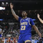 Mar 20, 2025; Providence, RI, USA; McNeese State Cowboys guard Brandon Murray (23) celebrates after a three point basket against the Clemson Tigers during the second half at Amica Mutual Pavilion. Mandatory Credit: Eric Canha-Imagn Images