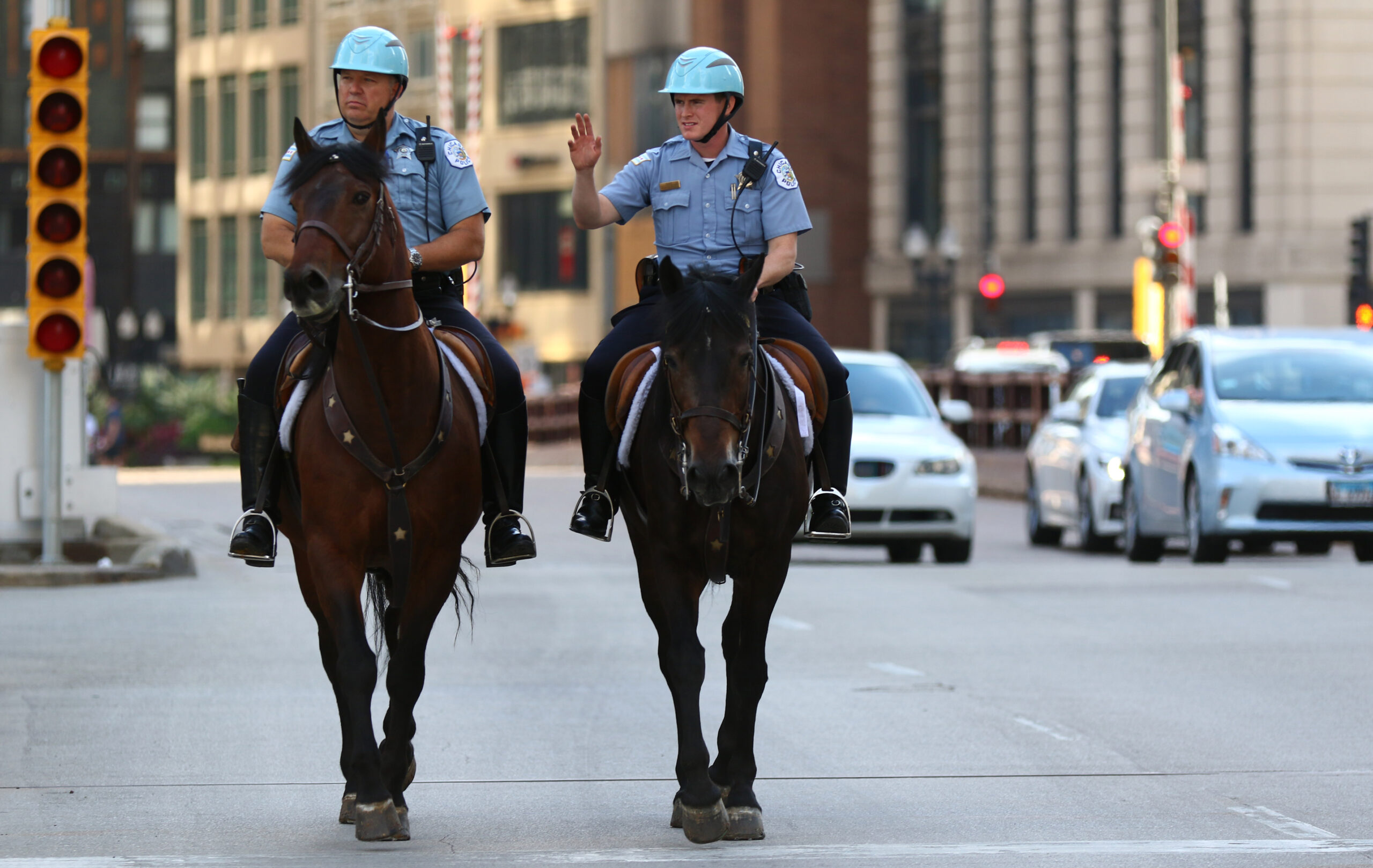 Mounted police officers patrol the 400 block of North Michigan...