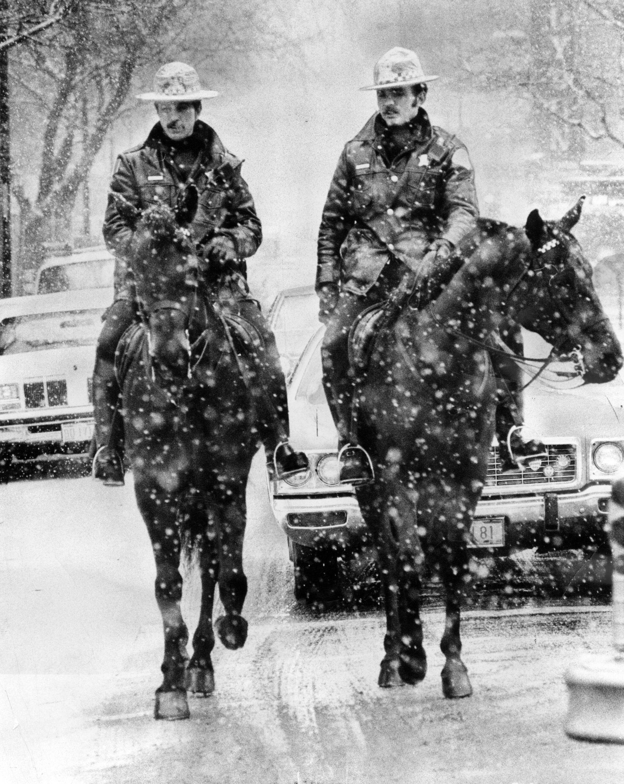 Mounted police officers John Barista, left, on his horse Buckingham...